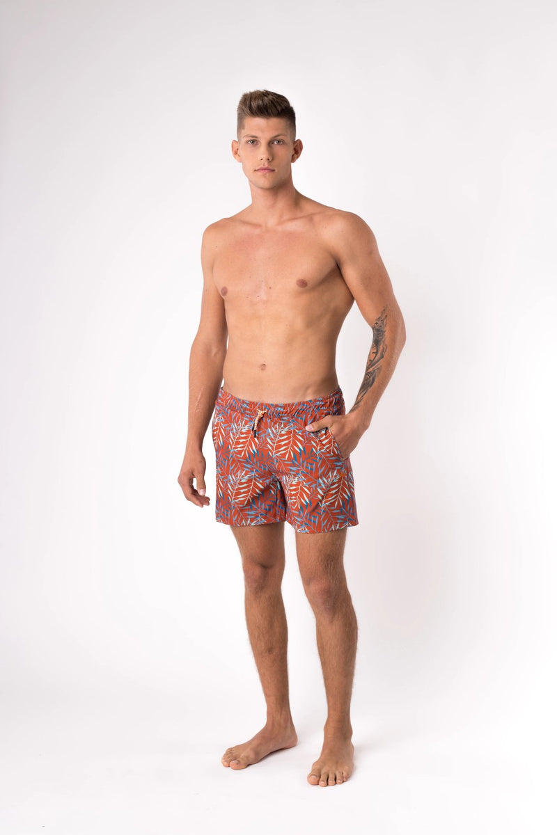 Man modelling swim trunks in burnt orange - Copper Bottom Swim